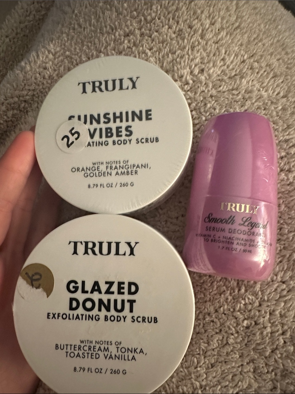 TRULY body scrub and deodorant. 2 are sealed in plastic, 1 new with no plastic.
